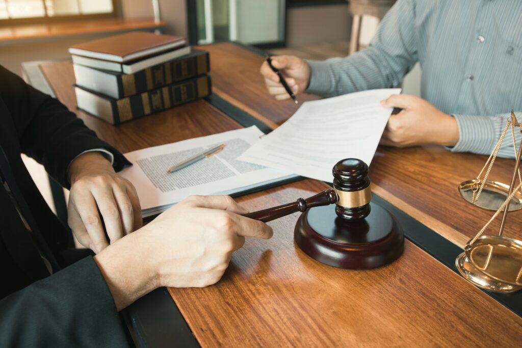 Client is bringing the documents to clarify the law to the lawyer at the prosecutor office.
