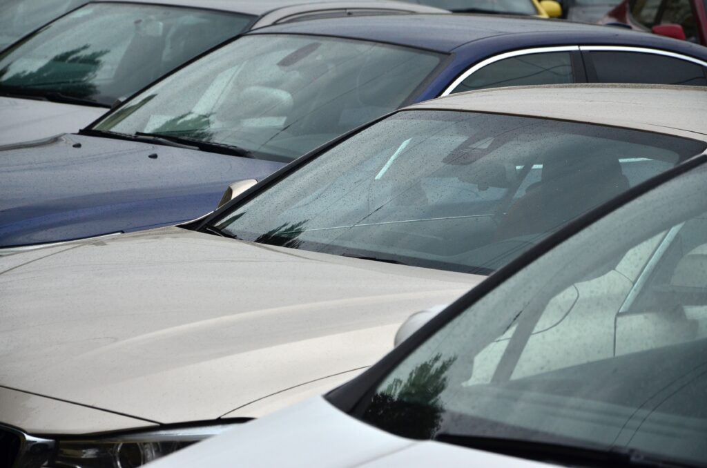 Roofs of several cars. A lot of cars stand close at rush hour